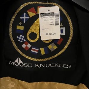 Moose knuckles long coat. Size xs . New. Black.  Gold fur .